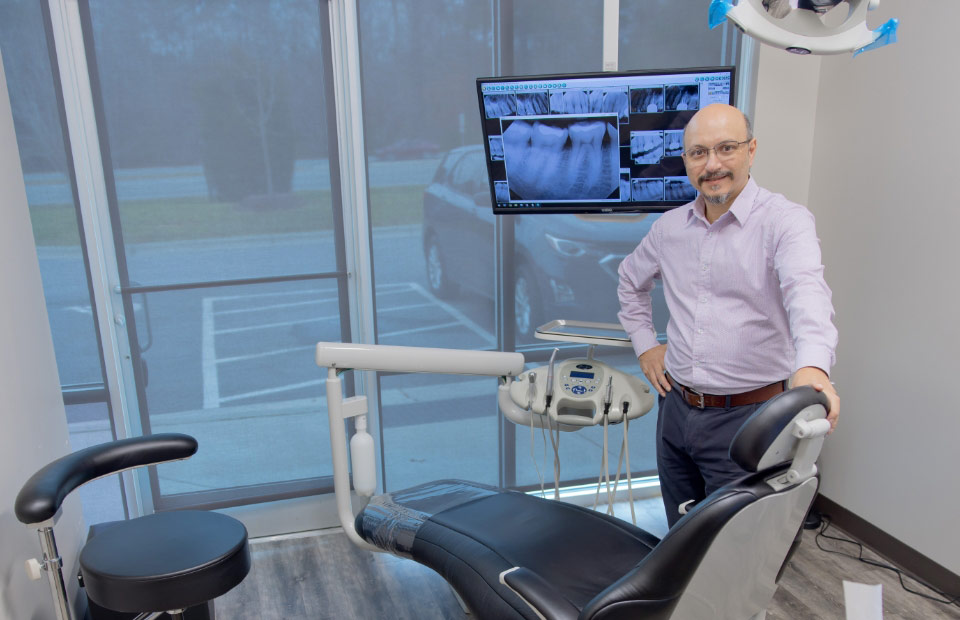 Dr. Manish Mistry in his Chapel Hill dental office Everbright Dental