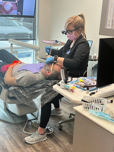 dental assistant working on a preventive dentistry patient at Brightside Dental